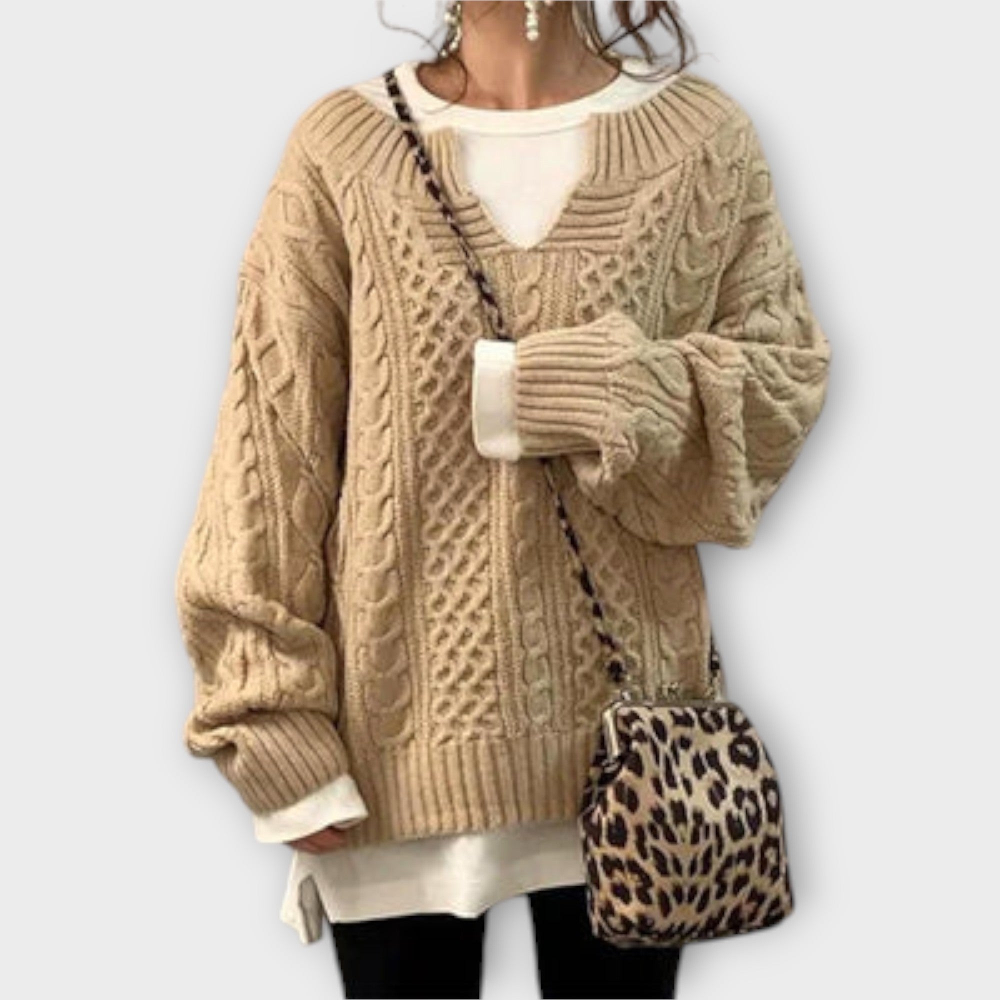 Extra large knitted sweater with braid pattern