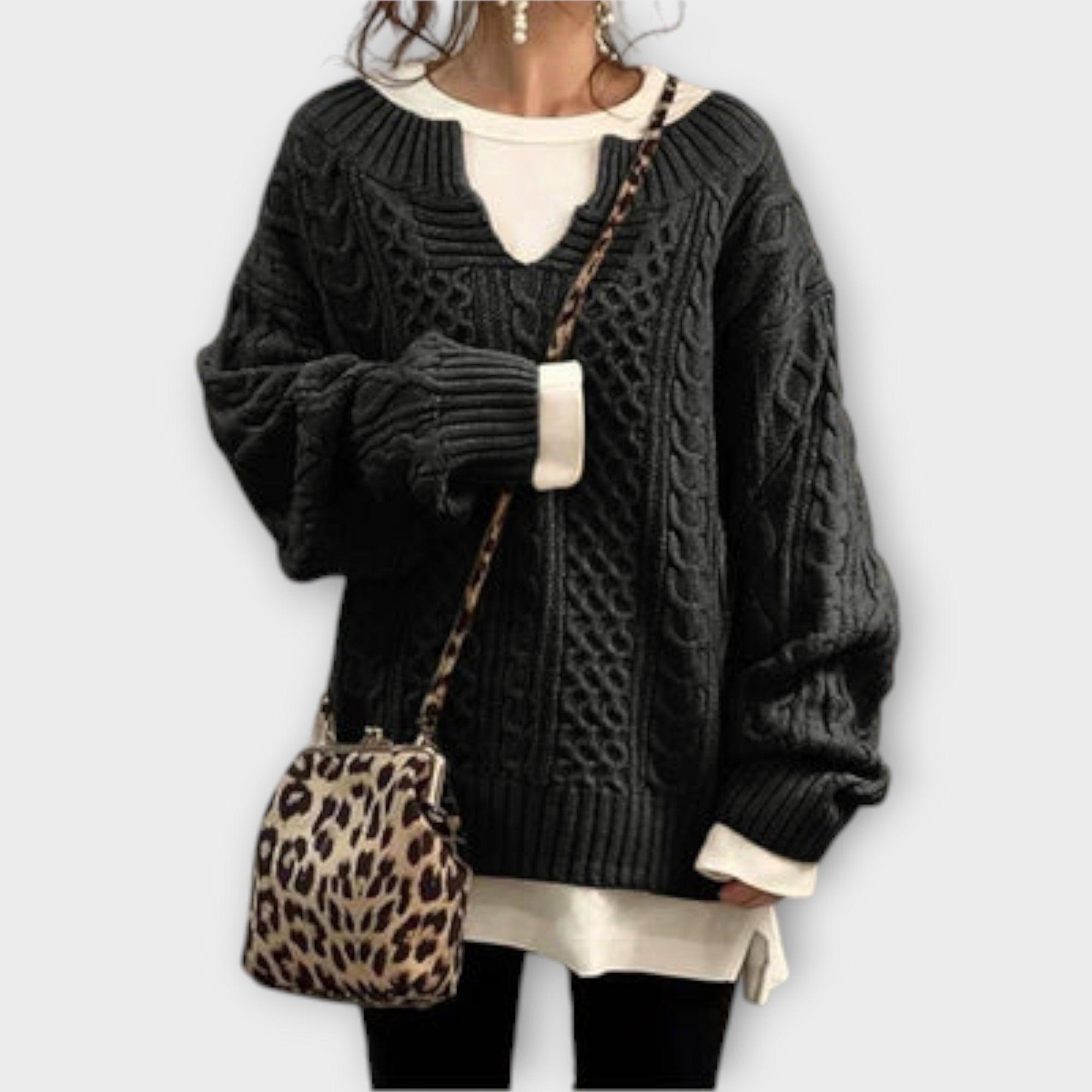 Extra large knitted sweater with braid pattern